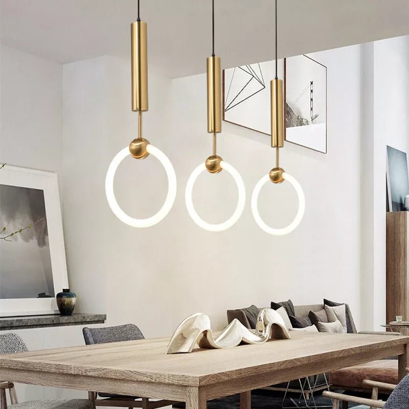 Brass pendant light featuring a minimalist design, ideal for illuminating a kitchen island with a Nordic aesthetic. 6