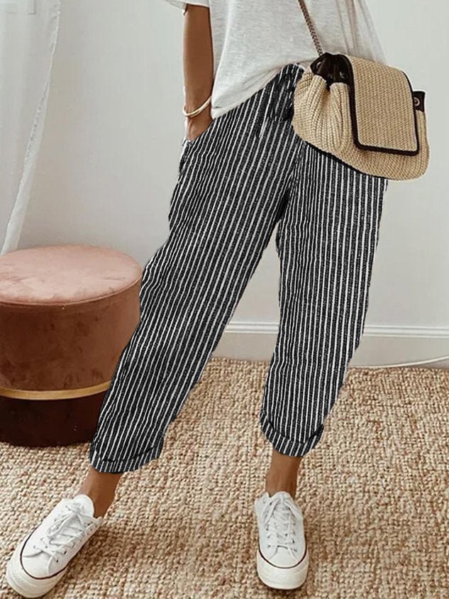 Breathable high-waist pants featuring a flowing silhouette and smooth finish, crafted from lightweight fabric for ultimate comfort and versatility. 9