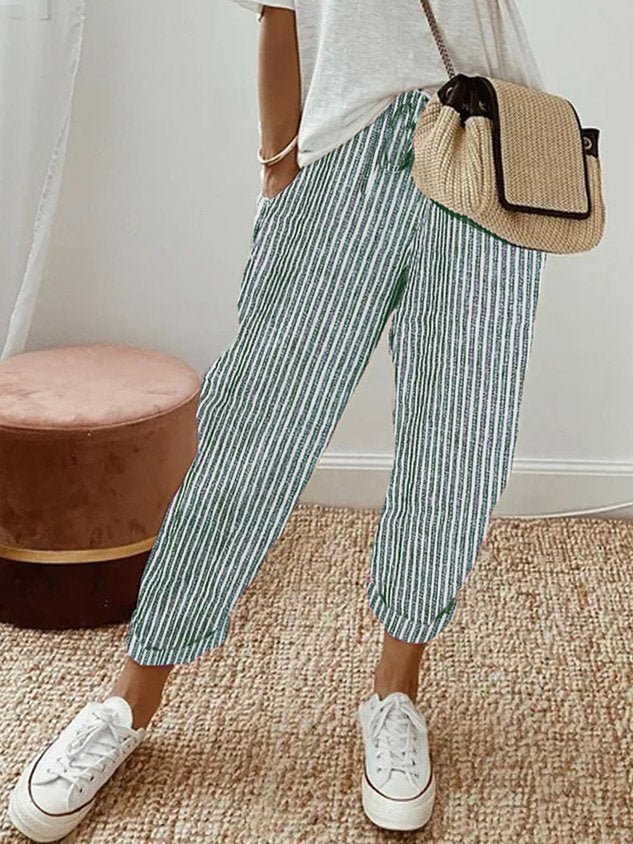 Breathable high-waist pants featuring a flowing silhouette and smooth finish, crafted from lightweight fabric for ultimate comfort and versatility. 10
