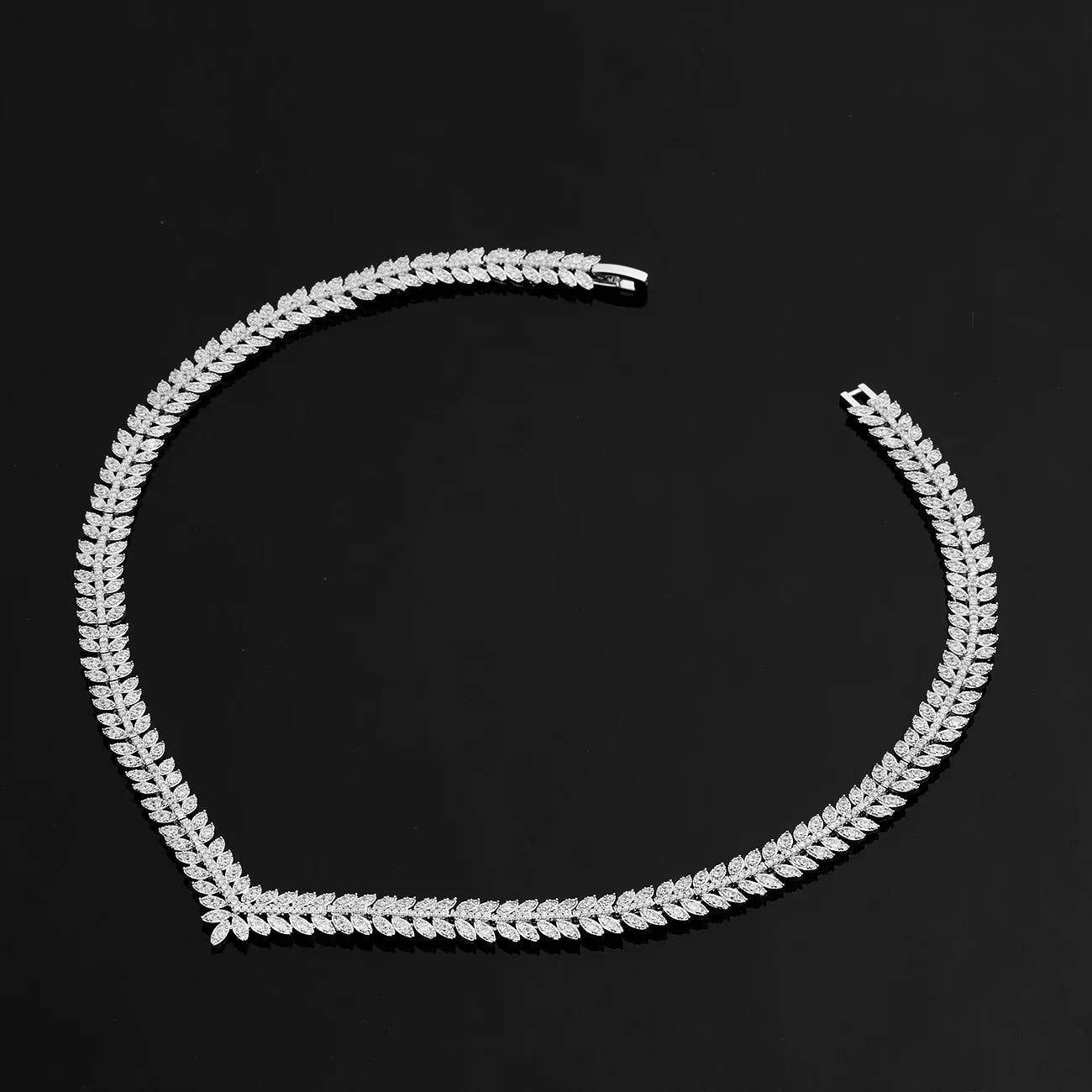 Bridal jewelry set featuring a stunning necklace, elegant earrings, a matching bracelet, and a beautiful ring, all in a 24K gold-plated 2