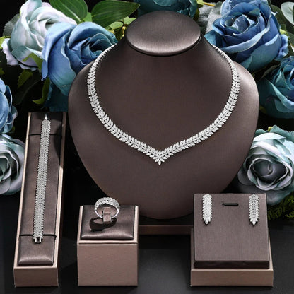 Bridal jewelry set featuring a stunning necklace, elegant earrings, a matching bracelet, and a beautiful ring, all in a 24K gold-plated 1
