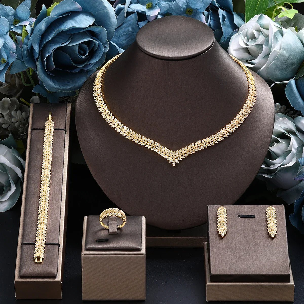 Bridal jewelry set featuring a stunning necklace, elegant earrings, a matching bracelet, and a beautiful ring, all in a 24K gold-plated 0