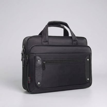 Canvas laptop bag featuring a multi-pocket design and adjustable strap, suitable for 14 to 19 inch laptops, ideal for work or travel. 2