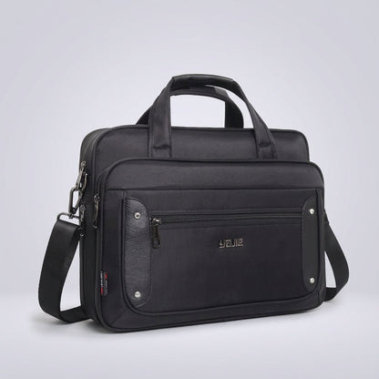 Canvas laptop bag featuring a multi-pocket design and adjustable strap, suitable for 14 to 19 inch laptops, ideal for work or travel. 0