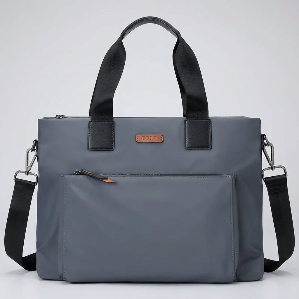 Gray and black canvas laptop bag featuring spacious compartments and an adjustable strap, designed for business commuters and men on the go. 0