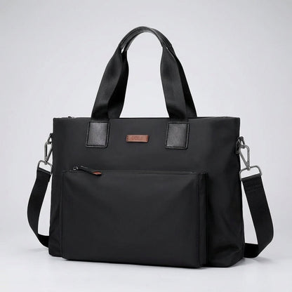Gray and black canvas laptop bag featuring spacious compartments and an adjustable strap, designed for business commuters and men on the go. 4