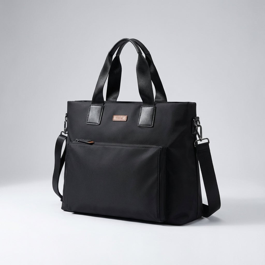 Gray and black canvas laptop bag featuring spacious compartments and an adjustable strap, designed for business commuters and men on the go. 2