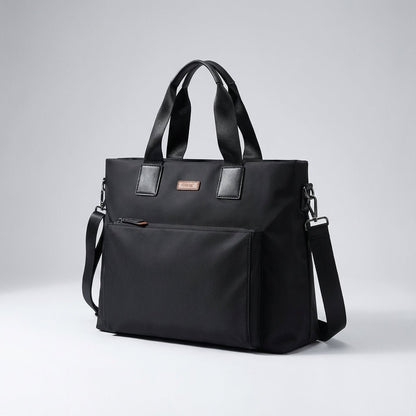 Gray and black canvas laptop bag featuring spacious compartments and an adjustable strap, designed for business commuters and men on the go. 2