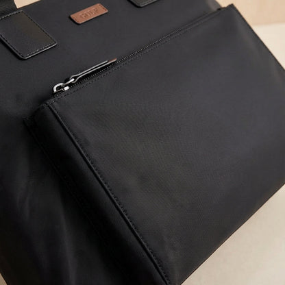 Gray and black canvas laptop bag featuring spacious compartments and an adjustable strap, designed for business commuters and men on the go. 3