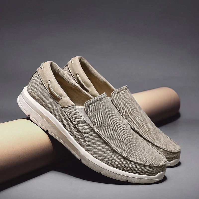 Lightweight women's canvas loafers featuring a breathable upper and flexible sole, perfect for casual wear and easy slip-on style. 0
