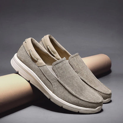 Lightweight women's canvas loafers featuring a breathable upper and flexible sole, perfect for casual wear and easy slip-on style. 0