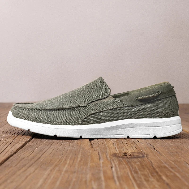 Lightweight women's canvas loafers featuring a breathable upper and flexible sole, perfect for casual wear and easy slip-on style. 1