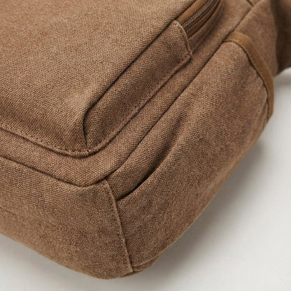 Canvas messenger bag featuring RFID blocking technology, multiple compartments for organization, and a durable waxed design for everyday use. 3