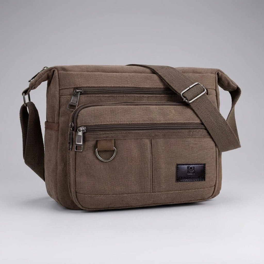 Canvas messenger bag featuring RFID blocking technology, multiple compartments for organization, and a durable waxed design for everyday use. 6