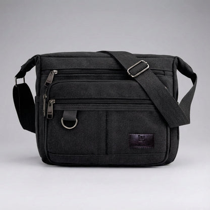 Canvas messenger bag featuring RFID blocking technology, multiple compartments for organization, and a durable waxed design for everyday use. 4
