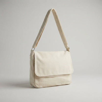 Canvas shoulder bag featuring an adjustable strap and spacious compartments, made from durable cotton polyester, ideal for everyday use and travel. 0