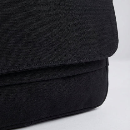 Canvas shoulder bag featuring an adjustable strap and spacious compartments, made from durable cotton polyester, ideal for everyday use and travel. 3