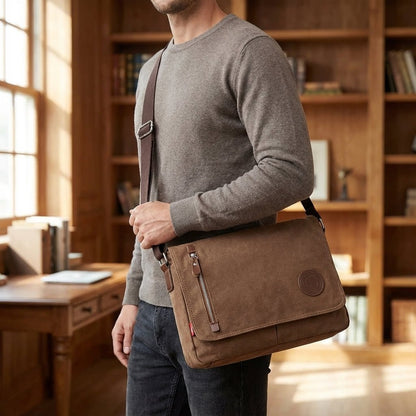Canvas shoulder bag featuring a padded tablet compartment, designed for waterproof and scratch-resistant durability, ideal for everyday use and travel. 1