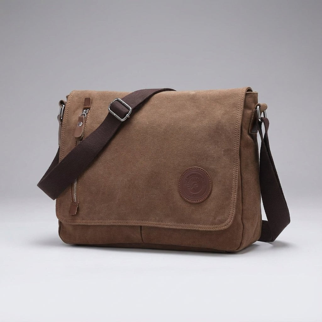 Canvas shoulder bag featuring a padded tablet compartment, designed for waterproof and scratch-resistant durability, ideal for everyday use and travel. 2