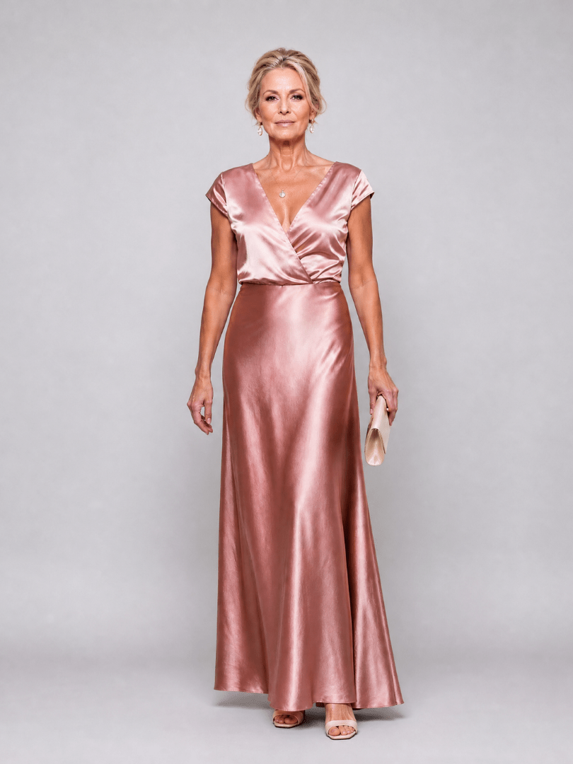 Elegant white cap sleeve maxi dress featuring a wrap bodice and flattering V neckline, perfect for formal occasions and summer events. 0