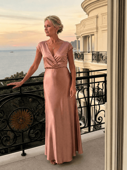 Elegant white cap sleeve maxi dress featuring a wrap bodice and flattering V neckline, perfect for formal occasions and summer events. 3