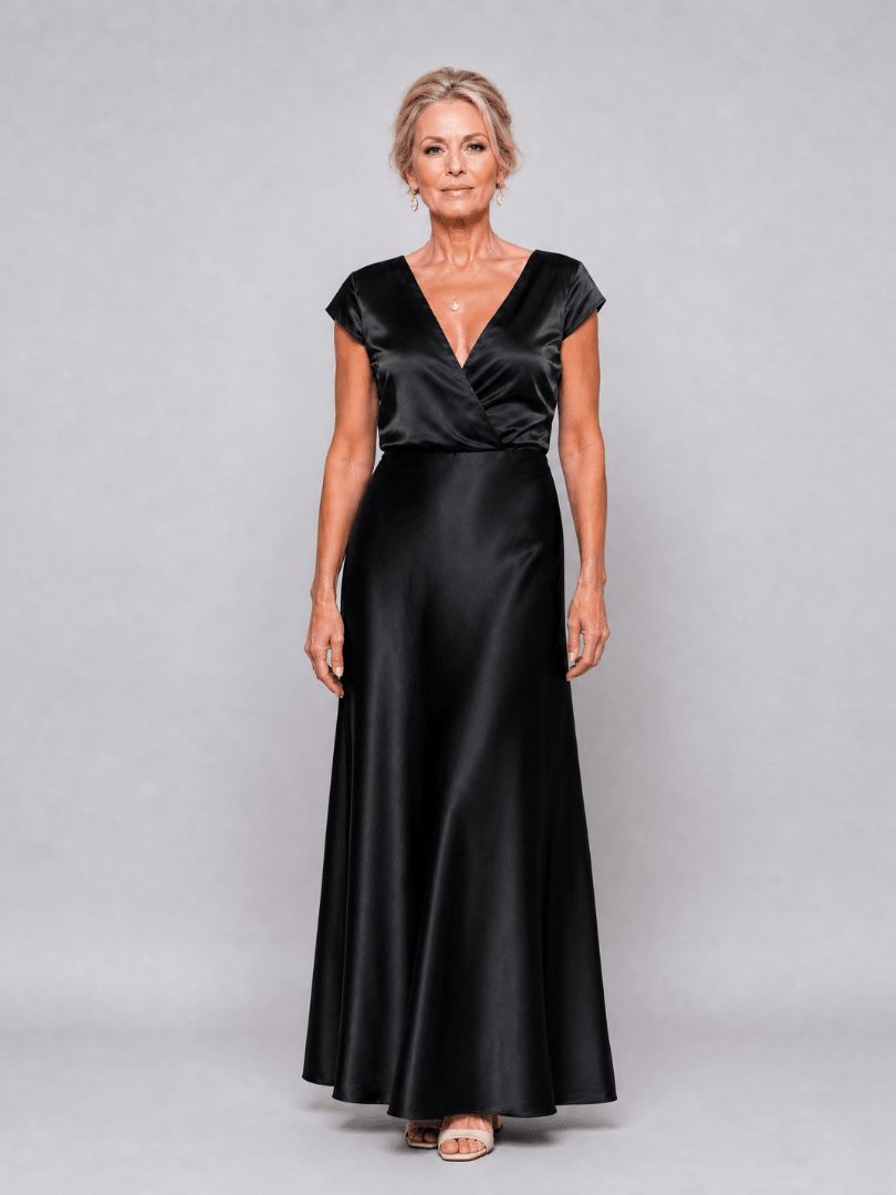 Elegant white cap sleeve maxi dress featuring a wrap bodice and flattering V neckline, perfect for formal occasions and summer events. 9