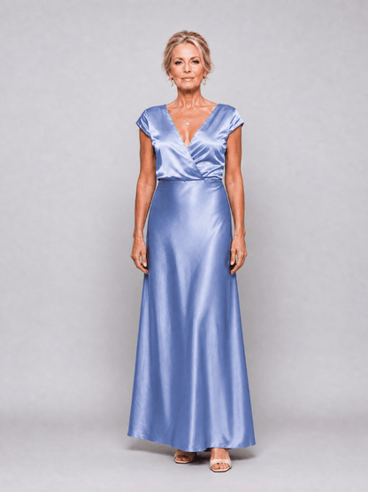 Elegant white cap sleeve maxi dress featuring a wrap bodice and flattering V neckline, perfect for formal occasions and summer events. 8