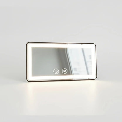 Car visor mirror with dimmable LED lighting, adjustable makeup mirror for on-the-go grooming, featuring a sleek black plastic and glass design. 2