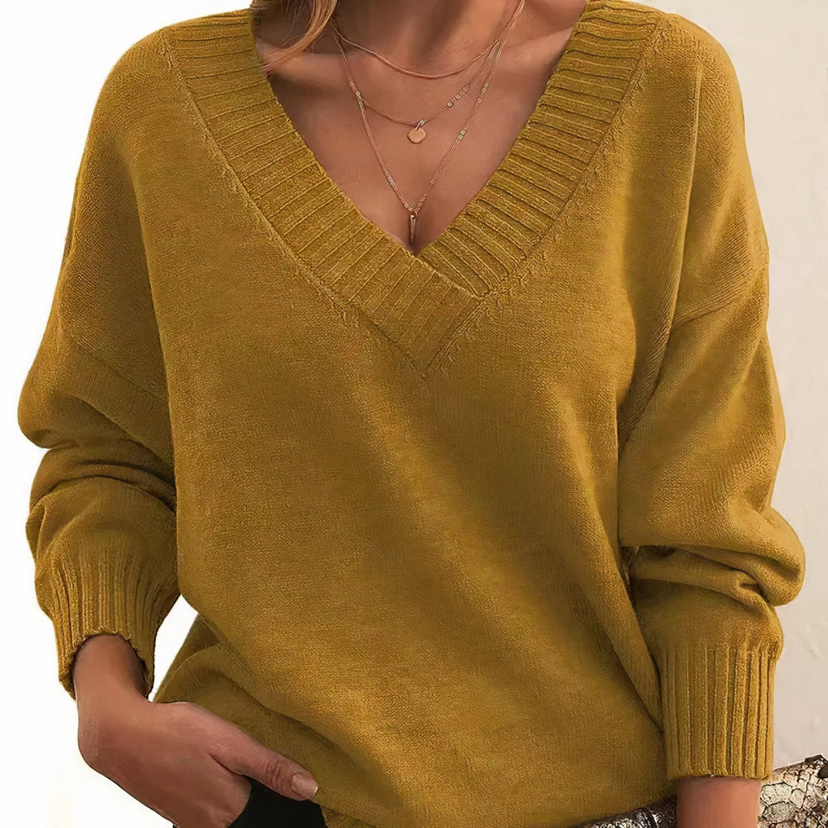 Soft cashmere blend women's sweater featuring a deep V-neck and relaxed fit, perfect for everyday comfort and style. 6