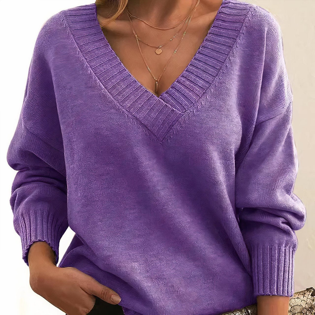 Soft cashmere blend women's sweater featuring a deep V-neck and relaxed fit, perfect for everyday comfort and style. 9