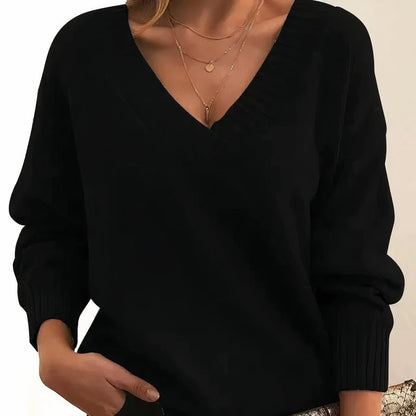 Soft cashmere blend women's sweater featuring a deep V-neck and relaxed fit, perfect for everyday comfort and style. 0