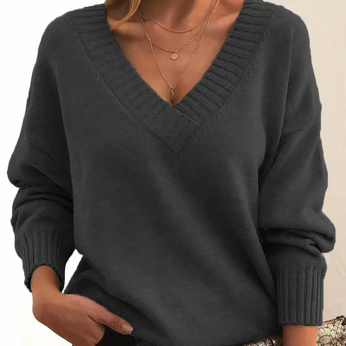 Soft cashmere blend women's sweater featuring a deep V-neck and relaxed fit, perfect for everyday comfort and style. 2