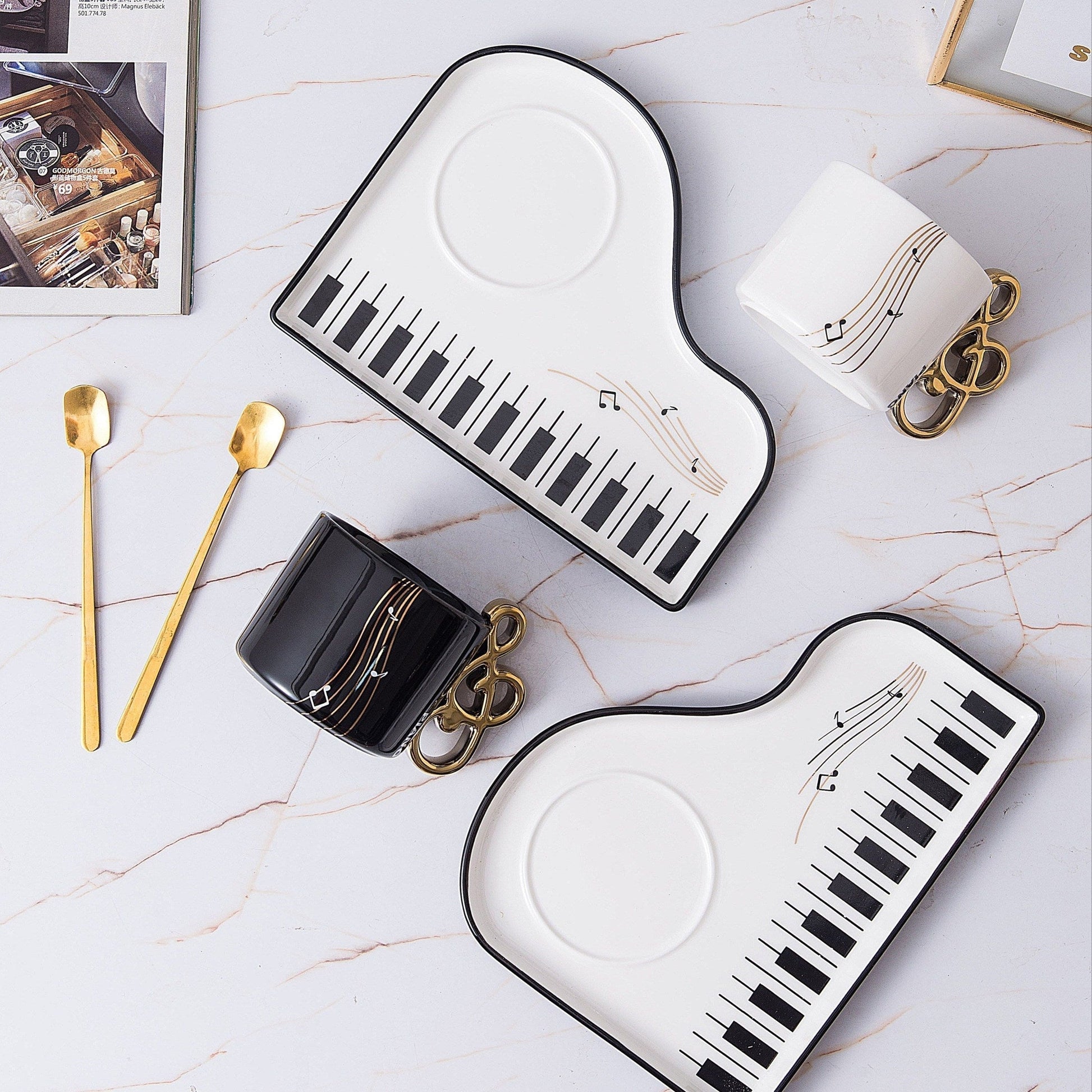 Ceramic cup and tray set featuring an elegant piano motif in white and black, complemented by a gold-plated spoon. 4