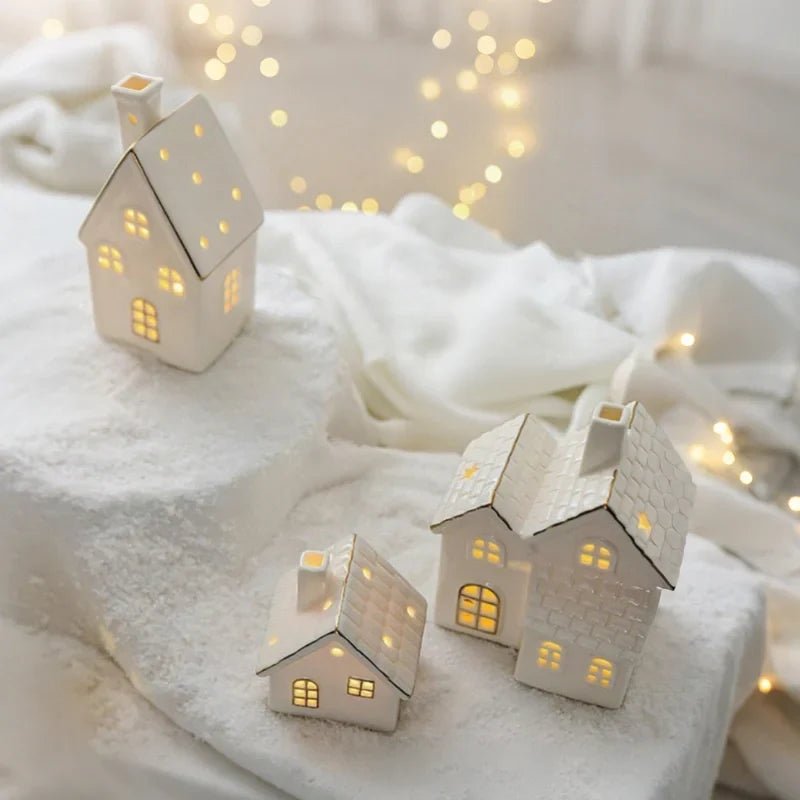 Ceramic Village Light with illuminated holiday houses, featuring intricate detailing and warm glowing lights, perfect for festive tabletop decoration. 7