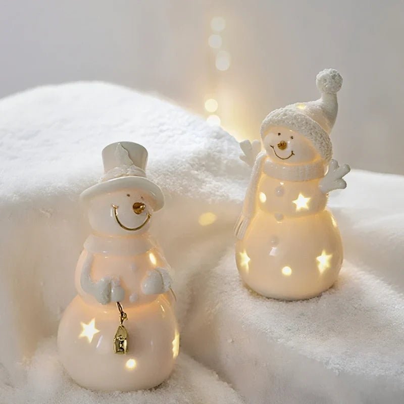 Ceramic Village Light with illuminated holiday houses, featuring intricate detailing and warm glowing lights, perfect for festive tabletop decoration. 9