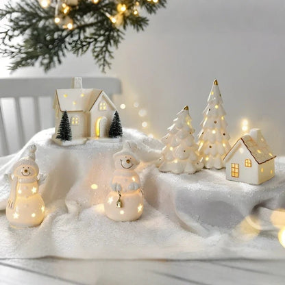 Ceramic Village Light with illuminated holiday houses, featuring intricate detailing and warm glowing lights, perfect for festive tabletop decoration. 5