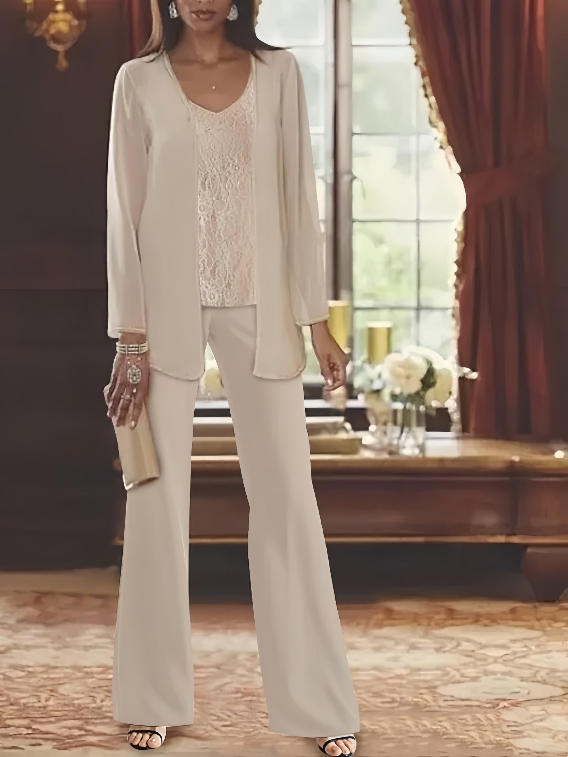 Elegant champagne chiffon pantsuit with jacket, designed for the mother of the bride, featuring a sophisticated and stylish look perfect for weddings. 0