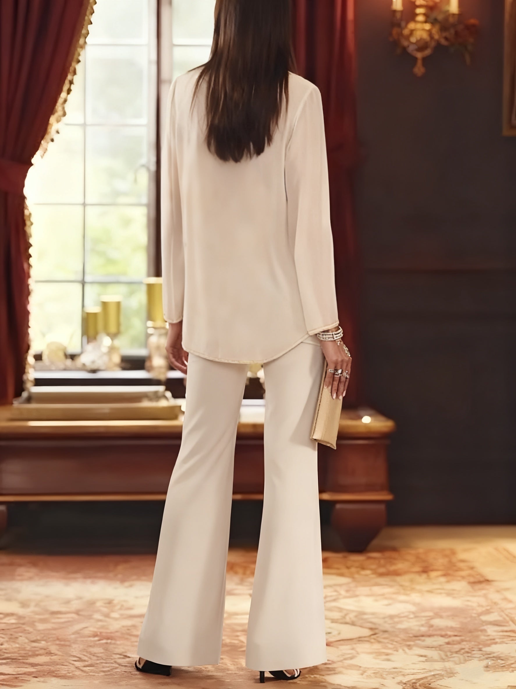 Elegant champagne chiffon pantsuit with jacket, designed for the mother of the bride, featuring a sophisticated and stylish look perfect for weddings. 1