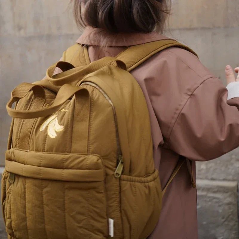 Children's backpack made from durable polyester featuring a stylish multi-colored plaid design, lightweight construction, and ergonomic shape for comfort. 1