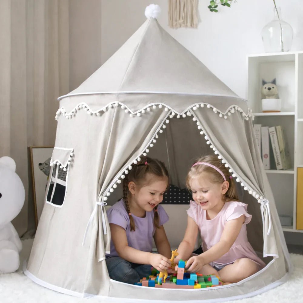 Children's canvas play teepee featuring solid pine poles, designed in a neutral style suitable for both indoor and outdoor play. 1