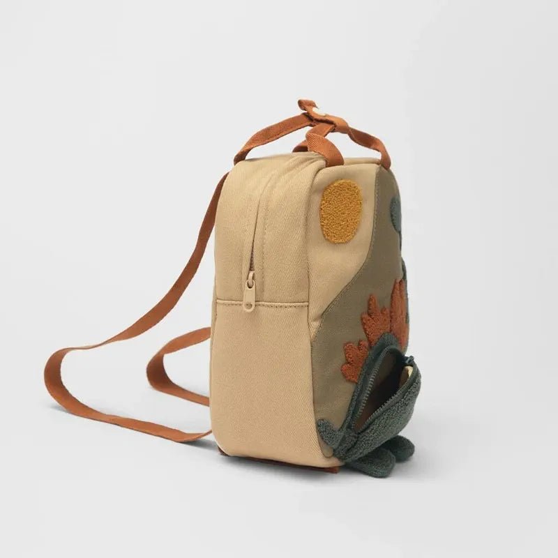 Children's dinosaur backpack featuring customizable embroidery, made from durable canvas with comfortable straps, designed in a fun multi-color pattern. 6