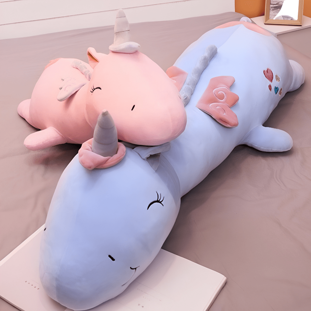Children's plush night light featuring a soft unicorn design, providing a soothing LED glow for a comforting bedtime experience. 2