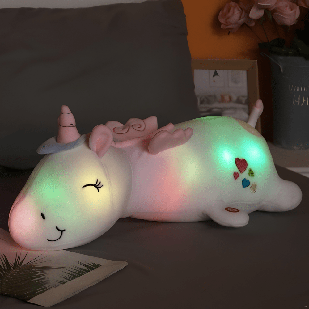 Children's plush night light featuring a soft unicorn design, providing a soothing LED glow for a comforting bedtime experience. 3
