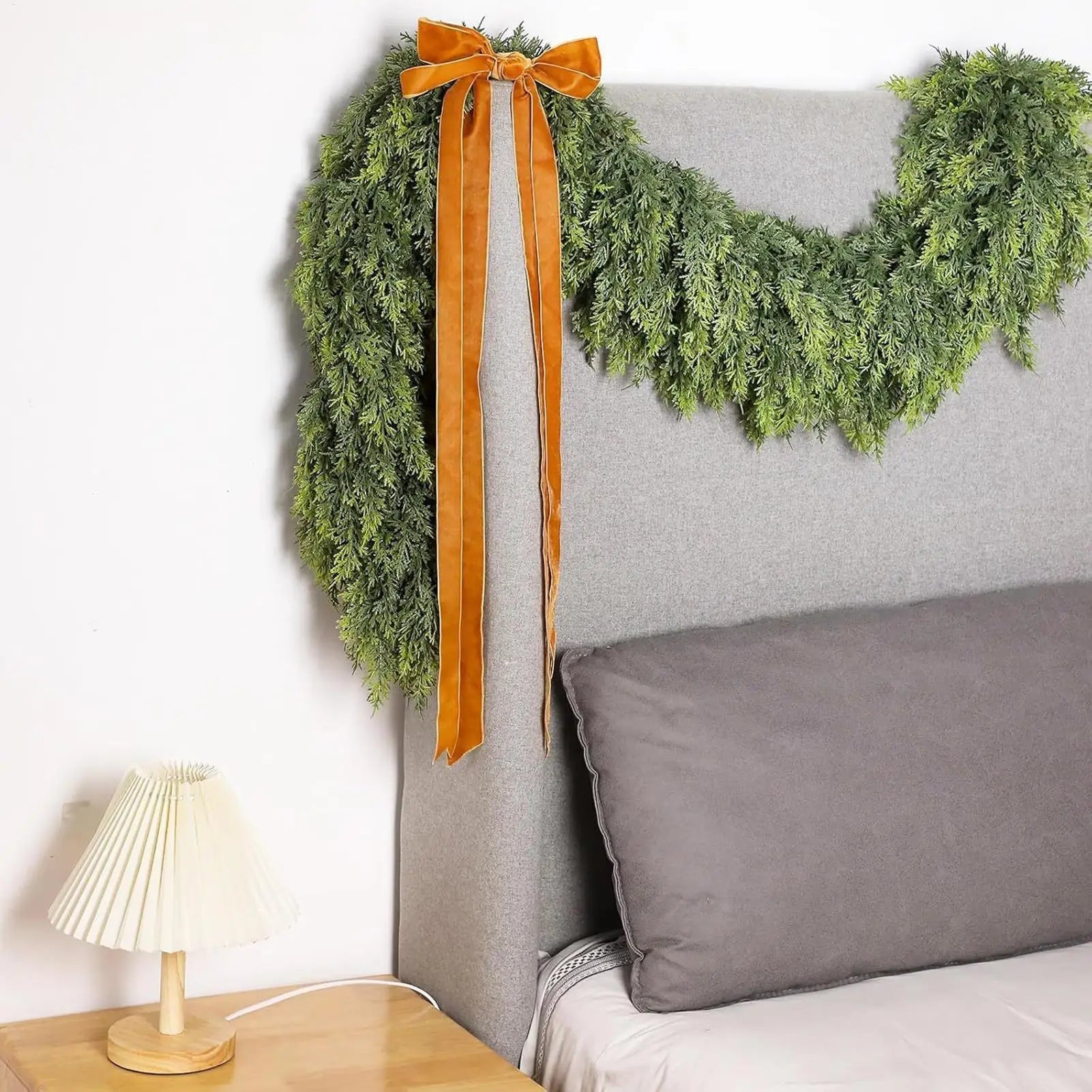 Christmas garland made of natural cypress branches, adorned with cotton accents, perfect for decorating fireplaces and windows during the winter season. 2