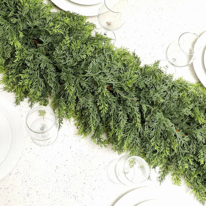 Christmas garland made of natural cypress branches, adorned with cotton accents, perfect for decorating fireplaces and windows during the winter season. 1