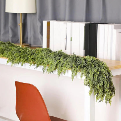 Christmas garland made of natural cypress branches, adorned with cotton accents, perfect for decorating fireplaces and windows during the winter season. 5