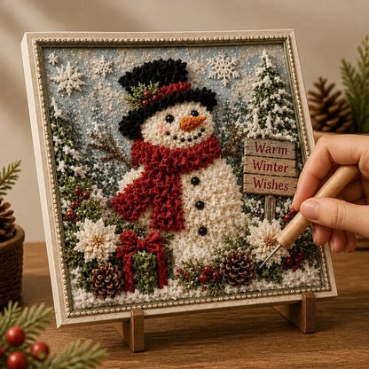 Christmas Yarn Art Kit featuring pre-punched board and wooden tool, designed with winter cottage, snowman, and cardinal motifs for festive crafting. 1