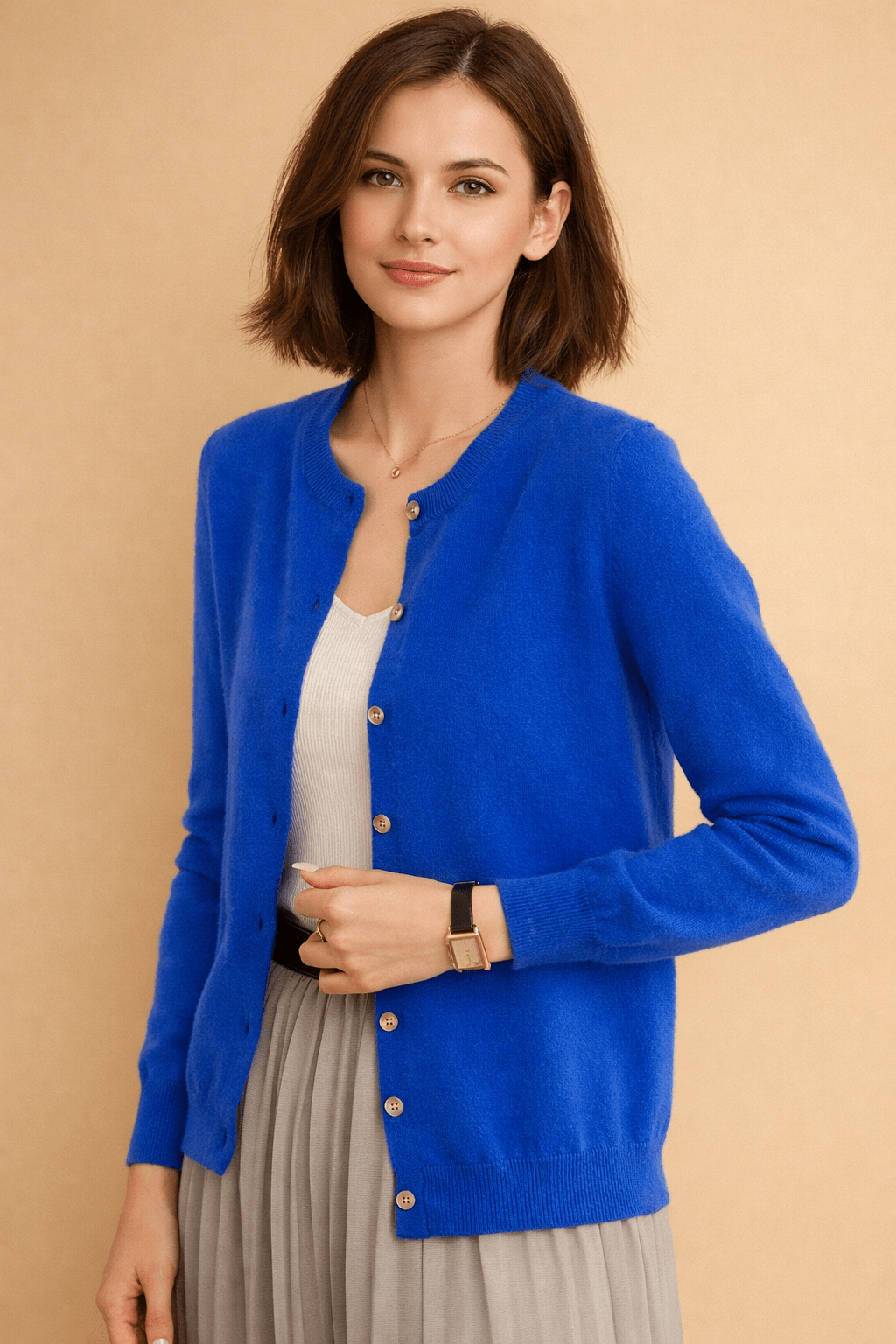 Classic women's cardigan featuring front buttons and a timeless round neck design, perfect for layering in any season. 2