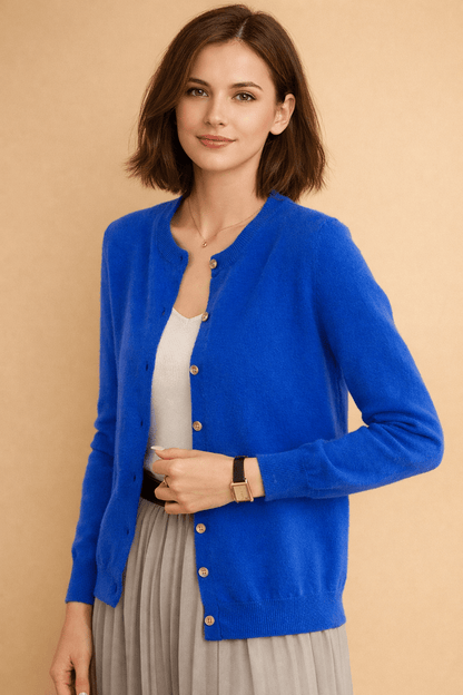 Classic women's cardigan featuring front buttons and a timeless round neck design, perfect for layering in any season. 2