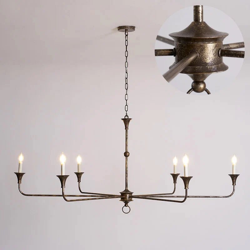 Classic chandelier light in antique brass with a candle-style design, featuring a flexible drop height, perfect for enhancing the elegance of dining rooms and entryways. 13